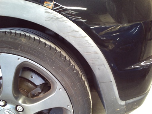  Honda Civic with accident damage to LH rear plastic wheel arch and quarter panel